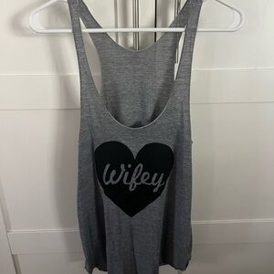 Gray sleeveless tank top with scoop neck and relaxed backless style